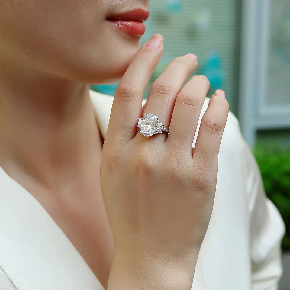 Three Stone Oval Moissanite And Half Moon Triple Pave Engagement Ring