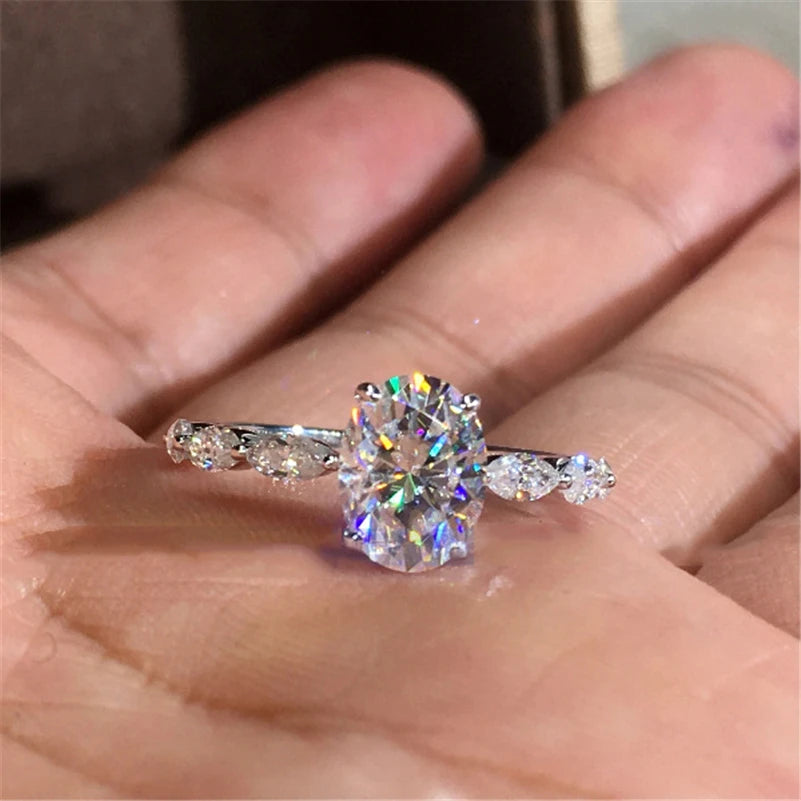 Oval Moissanite With Marquise Accents Engagement Ring