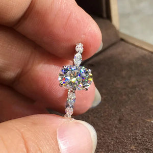 Oval Moissanite With Marquise Accents Engagement Ring