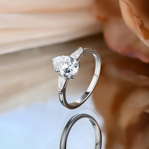 Three Stone Pear Moissanite And Tapered Baguette Engagement Ring