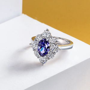 Oval Cut Sapphire Eight Prong Sterling Silver Halo Ring