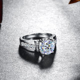 Moissanite With Channel Set Sapphire Accents Engagement Ring