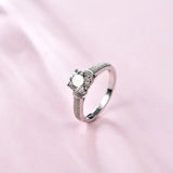 Round Moissanite Four Prong Side Stone Promise Engagement Ring